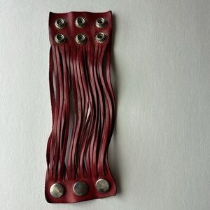 Leather cuff bracelet w three silver clasps.